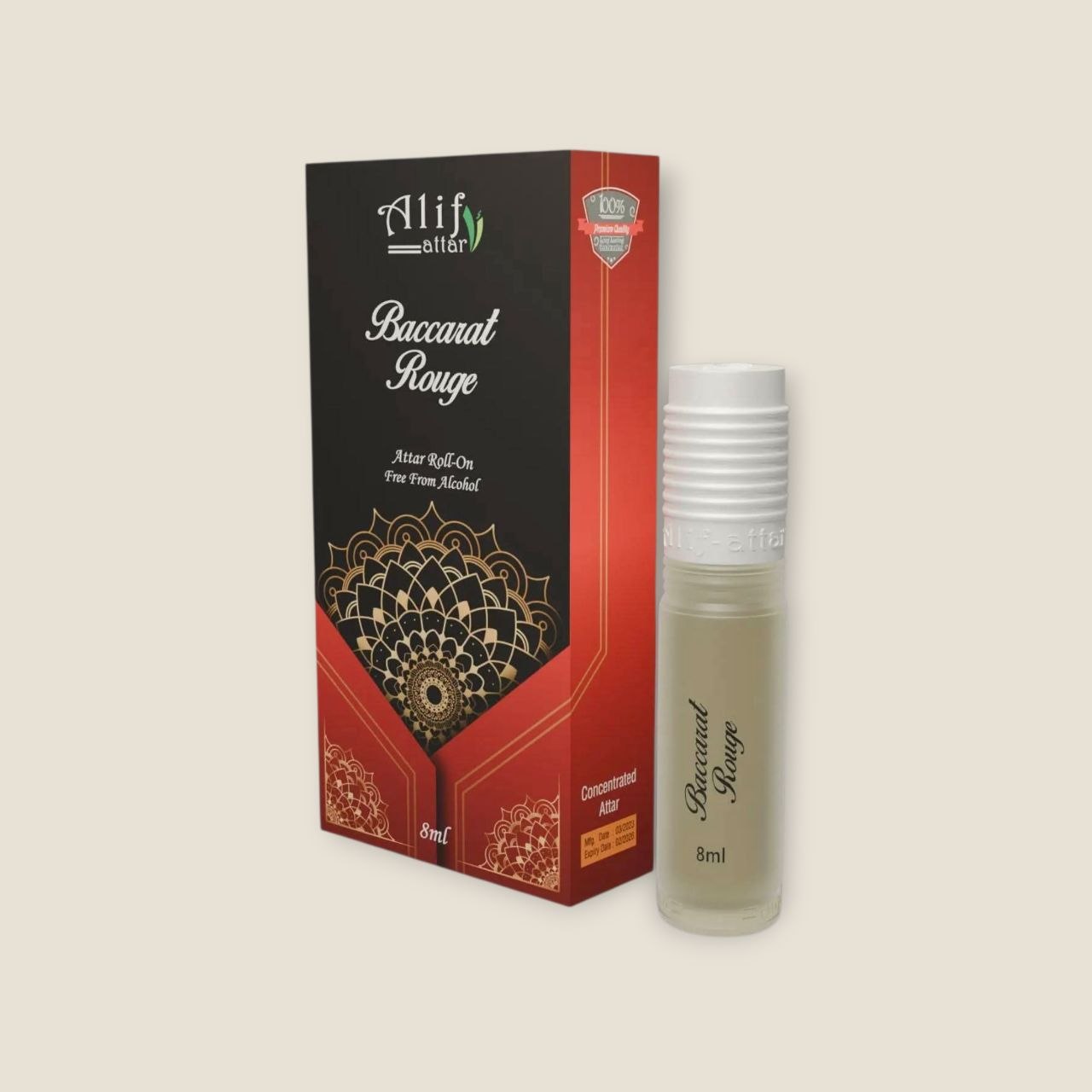 Small rollon perfume bottle standing next to a decorative red an Alif Baccarat Rouge Attar